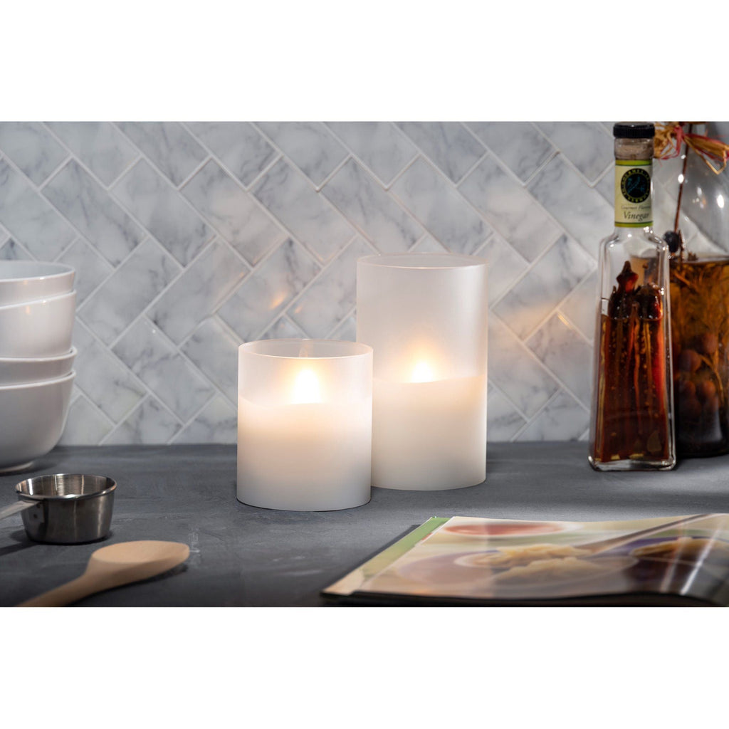 LED 5"D X 8"H Hand-Poured Wax Candle In Frosted Glass. Next Gen LED Flame Patented Technology w/ Adjustable Brightness Control. 2 C Batteries (Not Included). Multi Timer Function, 4, 6 & 8 hour.