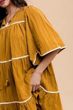 Tassel Contrast Trim Tie Neck Half Sleeve Tiered Dress For Women – Bohemian Inspired Tiered Dress with Tassel Accents and Contrast Trim for a Playful Look Stevvex