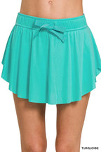 Zenana Ruffle Hem Tennis Skirt With Hidden Inner Pockets THRIXINE