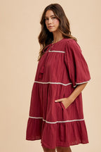 Tassel Contrast Trim Tie Neck Half Sleeve Tiered Dress – Bohemian-Inspired Dress with Tassel Details, Adjustable Tie Neck, and Tiered Design for a Flowing, Feminine Silhouette