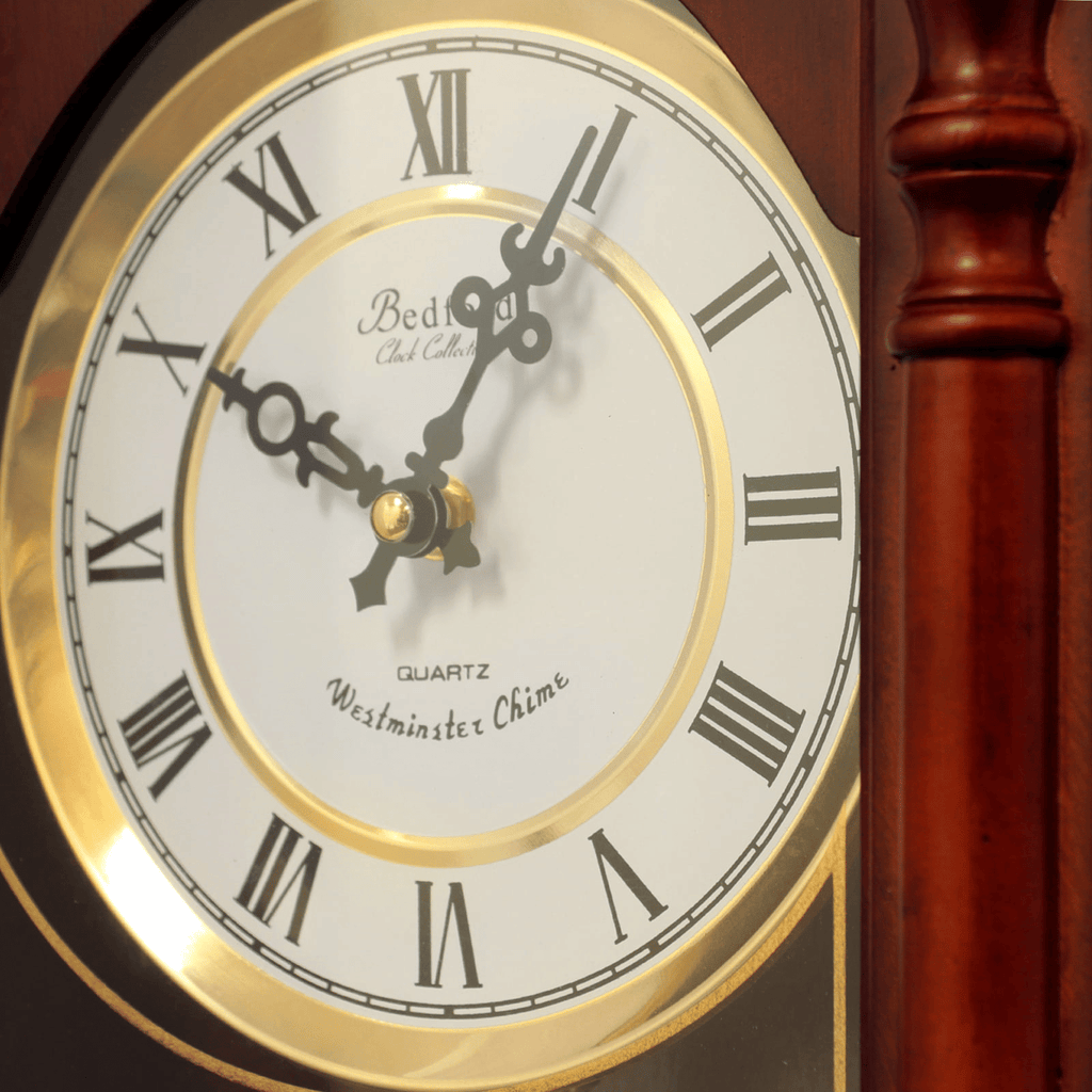 Bedford Clock Collection Classic 31" Chiming Wall Clock With Roman Numerals And A Swinging Pendulum in a Cherry Oak Finish