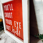 You'll Shoot Your Eye Out Sign - A Christmas Story Holiday Movie Quote Decor BandsCo Straps