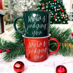 Santa Is Judging Mug 14.5oz Ceramic Campfire Style Holiday Coffee Mug Red Or Green Double Sided BandsCo Straps