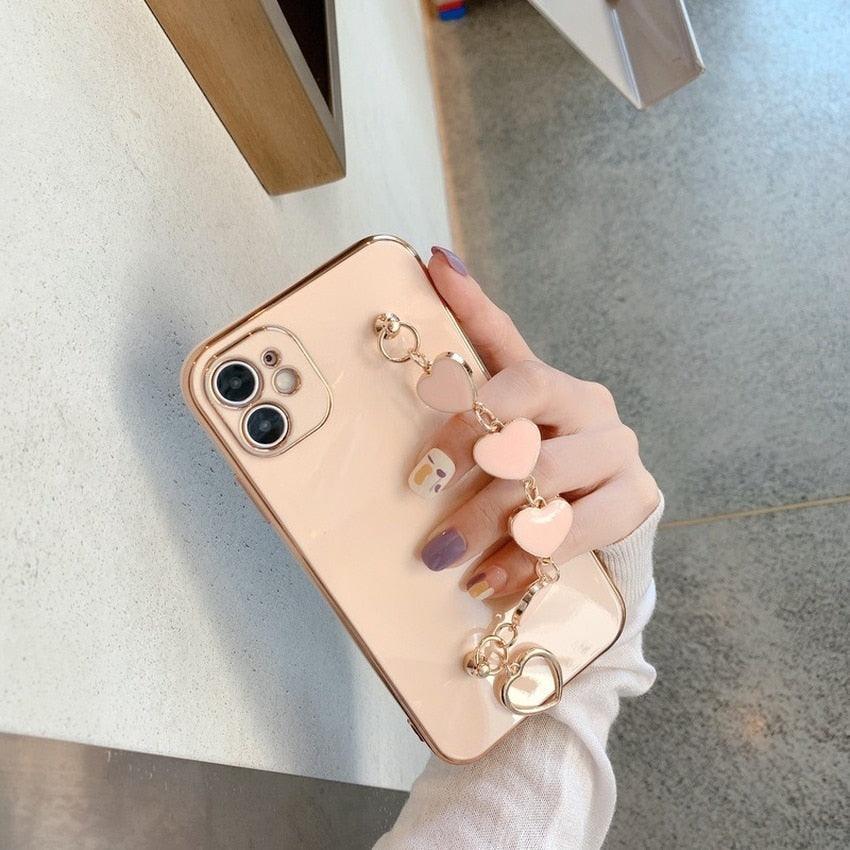 Luxury Women Silicone Phone Case Cover With Wrist Chain Bracelet for iPhone  Wristband Bracelet Hand Holder Cover for iPhone 13 12 11 Pro Max plating Case Heart Chain Cases for iPhone 7 8 Plus XR XS Max X Stevvex