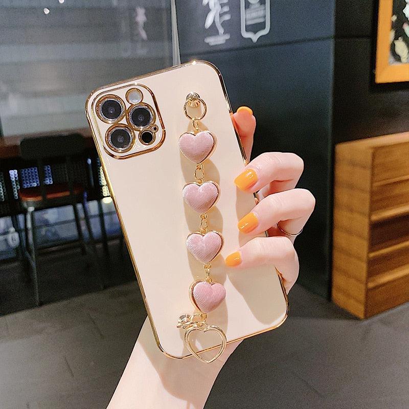Luxury Women Silicone Phone Case Cover With Wrist Chain Bracelet for iPhone  Wristband Bracelet Hand Holder Cover for iPhone 13 12 11 Pro Max plating Case Heart Chain Cases for iPhone 7 8 Plus XR XS Max X Stevvex
