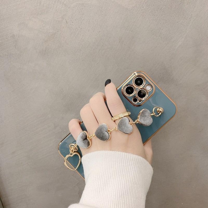Luxury Women Silicone Phone Case Cover With Wrist Chain Bracelet for iPhone  Wristband Bracelet Hand Holder Cover for iPhone 13 12 11 Pro Max plating Case Heart Chain Cases for iPhone 7 8 Plus XR XS Max X Stevvex