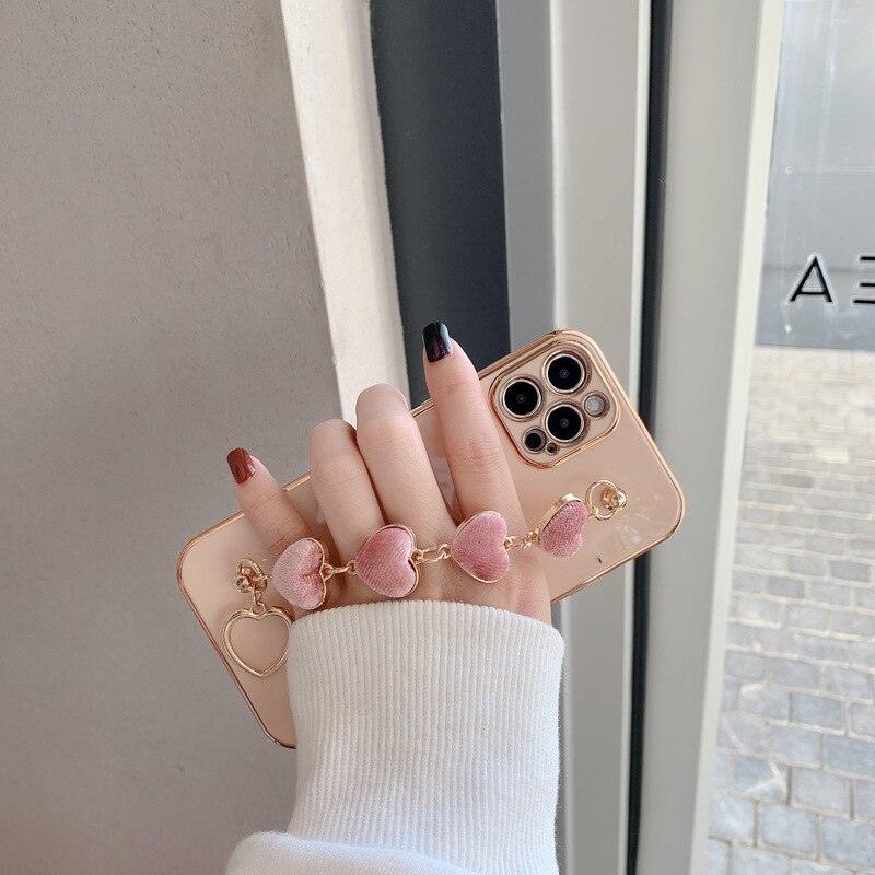 Luxury Women Silicone Phone Case Cover With Wrist Chain Bracelet for iPhone  Wristband Bracelet Hand Holder Cover for iPhone 13 12 11 Pro Max plating Case Heart Chain Cases for iPhone 7 8 Plus XR XS Max X Stevvex