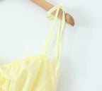 YENKYE Sexy Elegant Women Hollow Out Embroidery Yellow Sling Mini Dress Low Waist Lace Up Bandage Party Dresses Birthday Robe