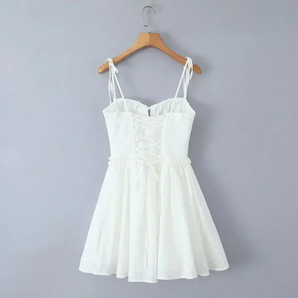 YENKYE Sexy Elegant Women Hollow Out Embroidery Yellow Sling Mini Dress Low Waist Lace Up Bandage Party Dresses Birthday Robe