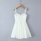 YENKYE Sexy Elegant Women Hollow Out Embroidery Yellow Sling Mini Dress Low Waist Lace Up Bandage Party Dresses Birthday Robe