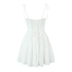 YENKYE Sexy Elegant Women Hollow Out Embroidery Yellow Sling Mini Dress Low Waist Lace Up Bandage Party Dresses Birthday Robe