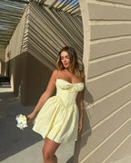 YENKYE Sexy Elegant Women Hollow Out Embroidery Yellow Sling Mini Dress Low Waist Lace Up Bandage Party Dresses Birthday Robe