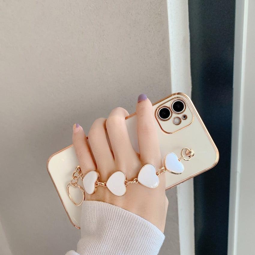Luxury Women Silicone Phone Case Cover With Wrist Chain Bracelet for iPhone  Wristband Bracelet Hand Holder Cover for iPhone 13 12 11 Pro Max plating Case Heart Chain Cases for iPhone 7 8 Plus XR XS Max X Stevvex