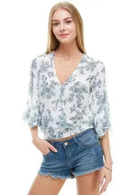 LONG SLEEVE SURPLICE FLORAL TOP | FEMSTYLO - SJB-DIAMOND ELITES