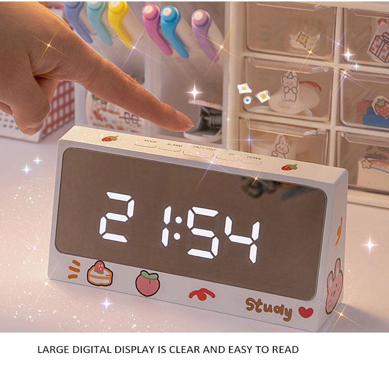 Digital Clock Table Clock Snooze Alarm Cute Silent Mirror Clock Student Desktop Mirror Surface LED Alarm Clock with USB Charger 12/24H Easy Snooze Function Adjustable Brightness Alarm Clocks for Bedroom LED Clock Electronic Clock for Children Stevvex