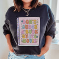 Don't Judge A Book Sweatshirt Peachy Sunday