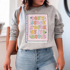 Don't Judge A Book Sweatshirt Peachy Sunday