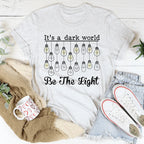 It's A Dark World Be The Light Tee