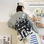 New Trendy Casual Women Purple Backpacks Fashionable Black Cow Pattern Travel Bag And School Bag for Teenager And Girls Stevvex