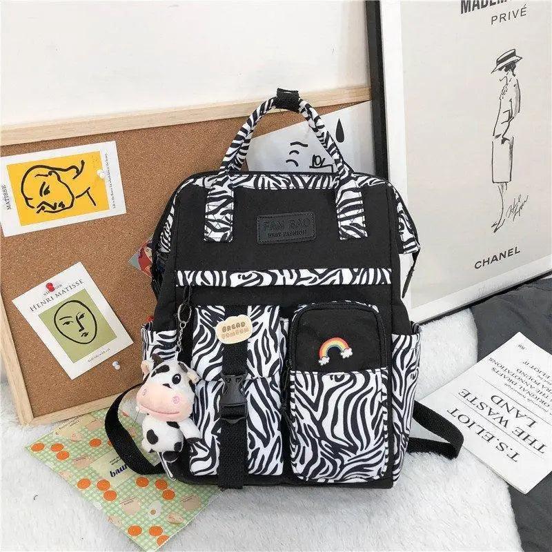New Trendy Casual Women Purple Backpacks Fashionable Black Cow Pattern Travel Bag And School Bag for Teenager And Girls Stevvex