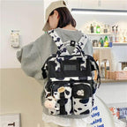New Trendy Casual Women Purple Backpacks Fashionable Black Cow Pattern Travel Bag And School Bag for Teenager And Girls Stevvex