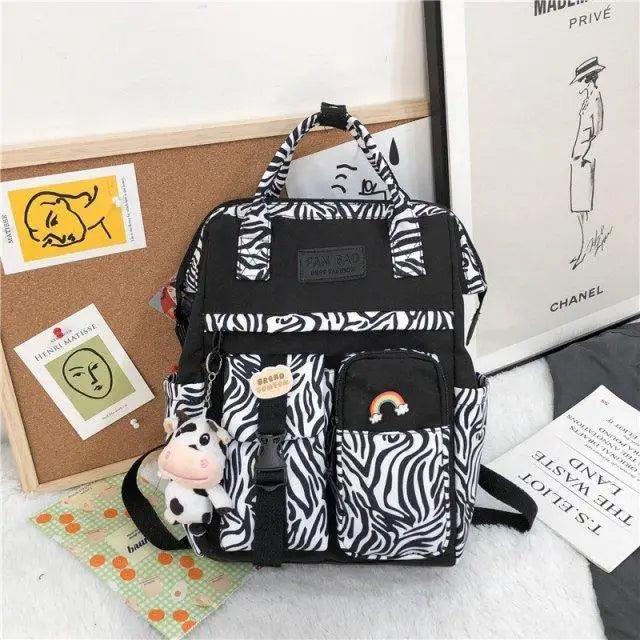 New Trendy Casual Women Purple Backpacks Fashionable Black Cow Pattern Travel Bag And School Bag for Teenager And Girls Stevvex