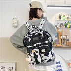 New Trendy Casual Women Purple Backpacks Fashionable Black Cow Pattern Travel Bag And School Bag for Teenager And Girls Stevvex
