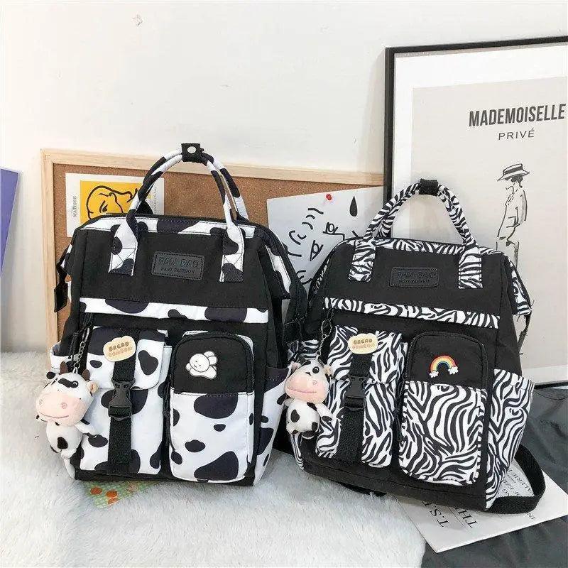 New Trendy Casual Women Purple Backpacks Fashionable Black Cow Pattern Travel Bag And School Bag for Teenager And Girls Stevvex
