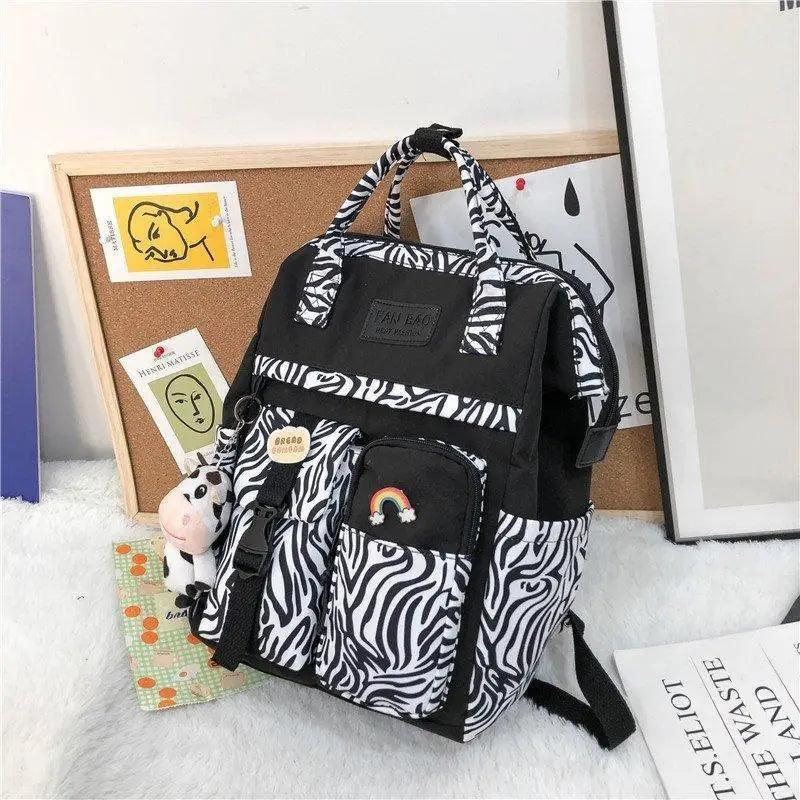 New Trendy Casual Women Purple Backpacks Fashionable Black Cow Pattern Travel Bag And School Bag for Teenager And Girls Stevvex