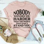 Nobody Watches You Harder Than The People That Can't Stand You Tee Peachy Sunday