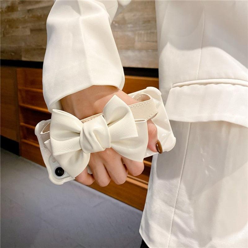 Oversized Beautiful Cute Bowknot Ribbon Cute Unique Pattern Case Soft Lightweight Leather Wrist Holder Stand Soft Phone Case For iPhone 14 13 7 8 Plus X XS XR MAX 11 Pro Phone Case Stevvex