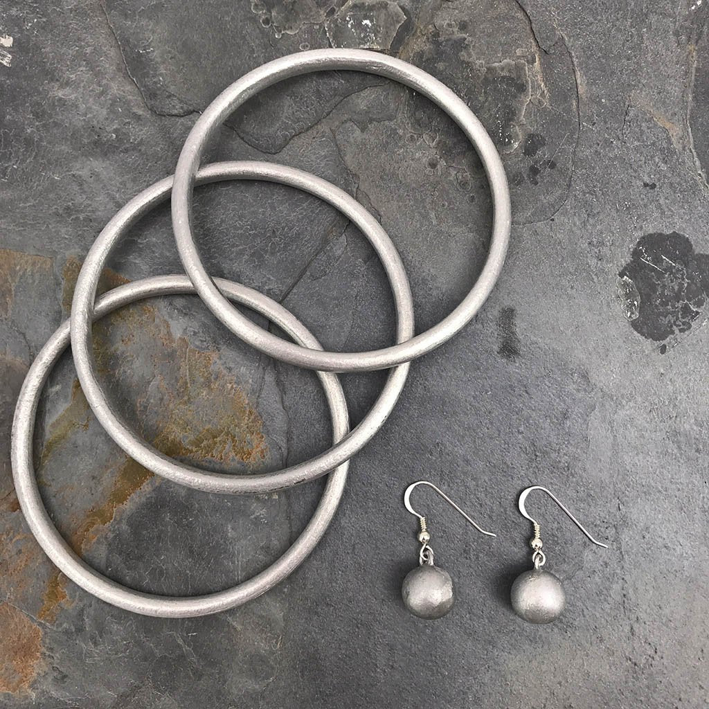 Recycled Bomb Dangle Earrings Upcycled Aluminum Bomb Parts 1.25in Handmade Laos BandsCo Straps