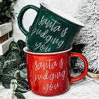 Santa Is Judging Mug 14.5oz Ceramic Campfire Style Holiday Coffee Mug Red Or Green Double Sided BandsCo Straps