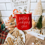 Santa Is Judging Mug 14.5oz Ceramic Campfire Style Holiday Coffee Mug Red Or Green Double Sided BandsCo Straps