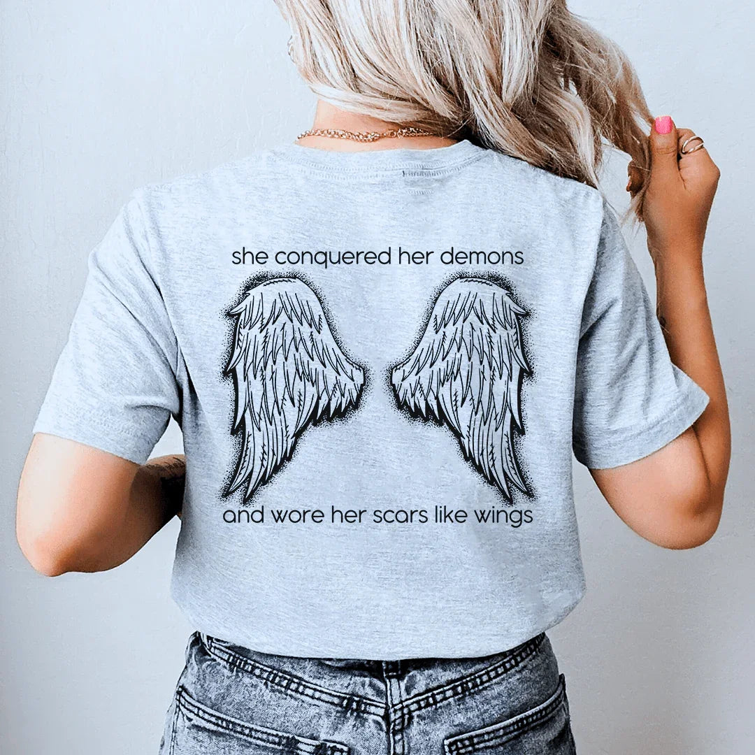 She Conquered Her Demons And Wore Her Scars Like Wings Tee Peachy Sunday