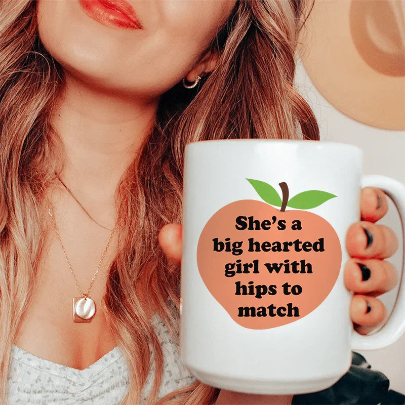 She's A Big Hearted Girl With Hips to Match Ceramic Mug 15 oz Peachy Sunday