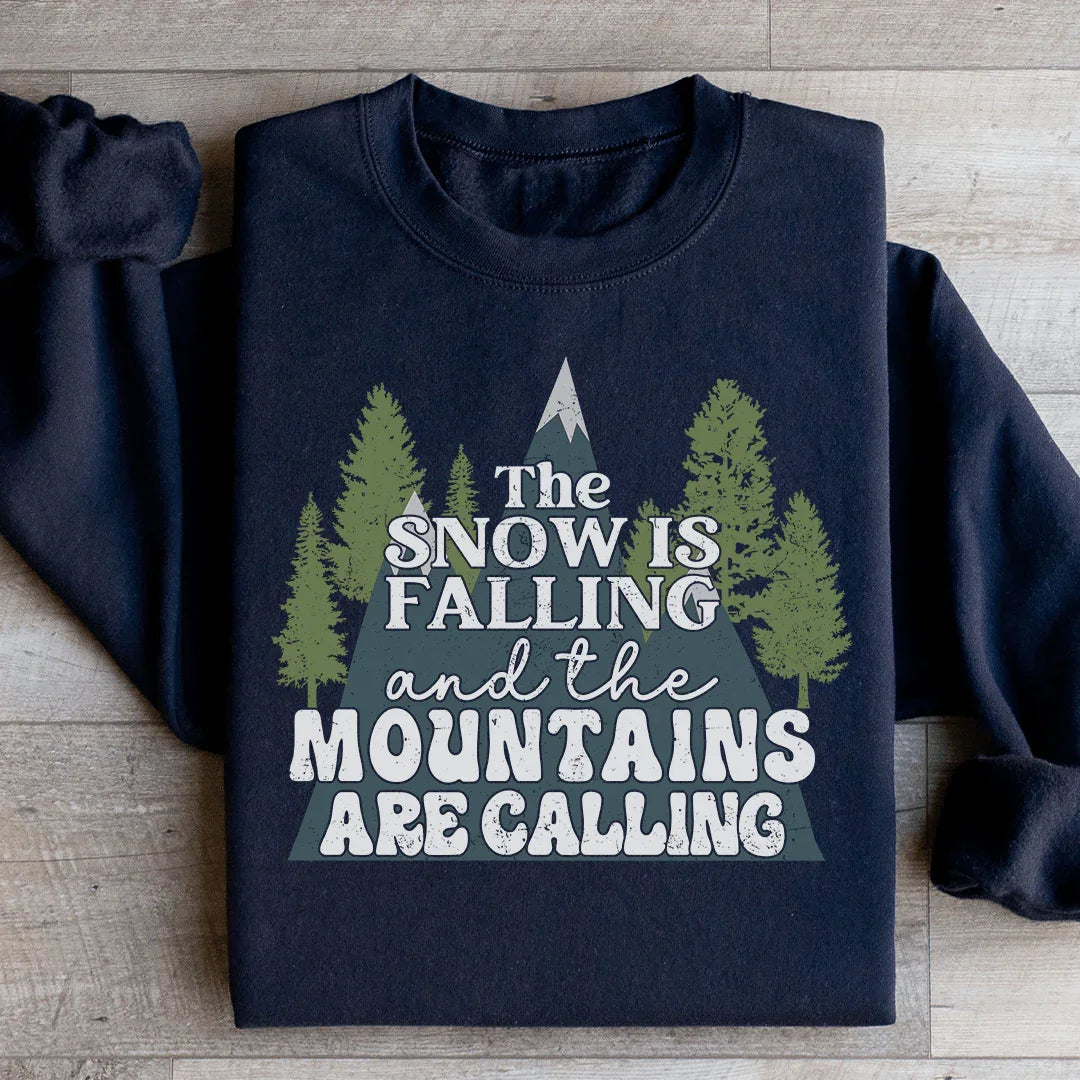 The Snow Is Falling And The Mountains Are Calling Sweatshirt Peachy Sunday