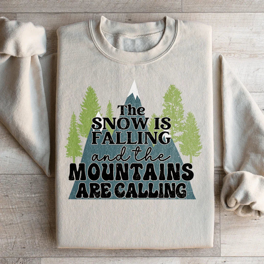 The Snow Is Falling And The Mountains Are Calling Sweatshirt Peachy Sunday