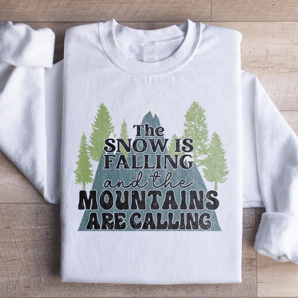 The Snow Is Falling And The Mountains Are Calling Sweatshirt Peachy Sunday