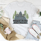 The Snow Is Falling And The Mountains Are Calling Tee Peachy Sunday