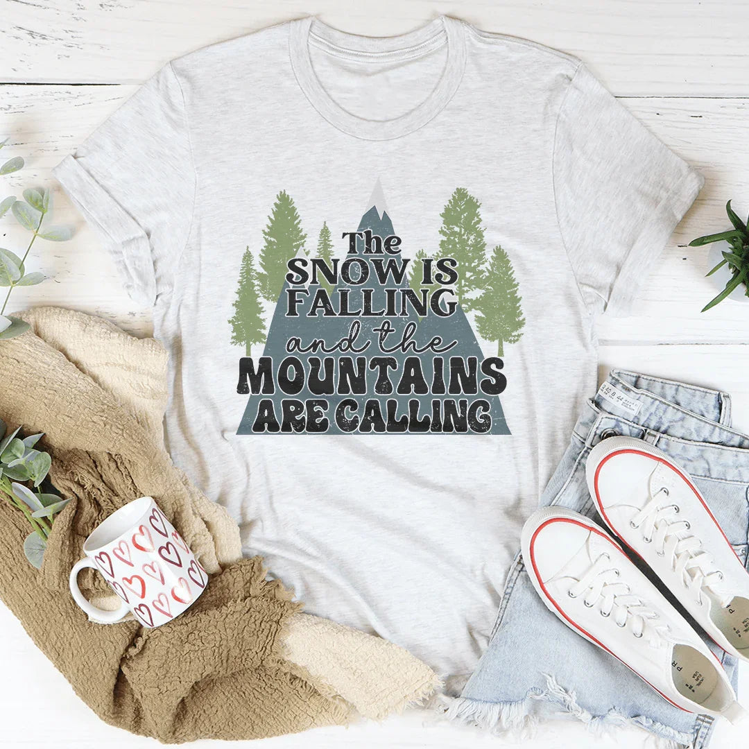 The Snow Is Falling And The Mountains Are Calling Tee Peachy Sunday