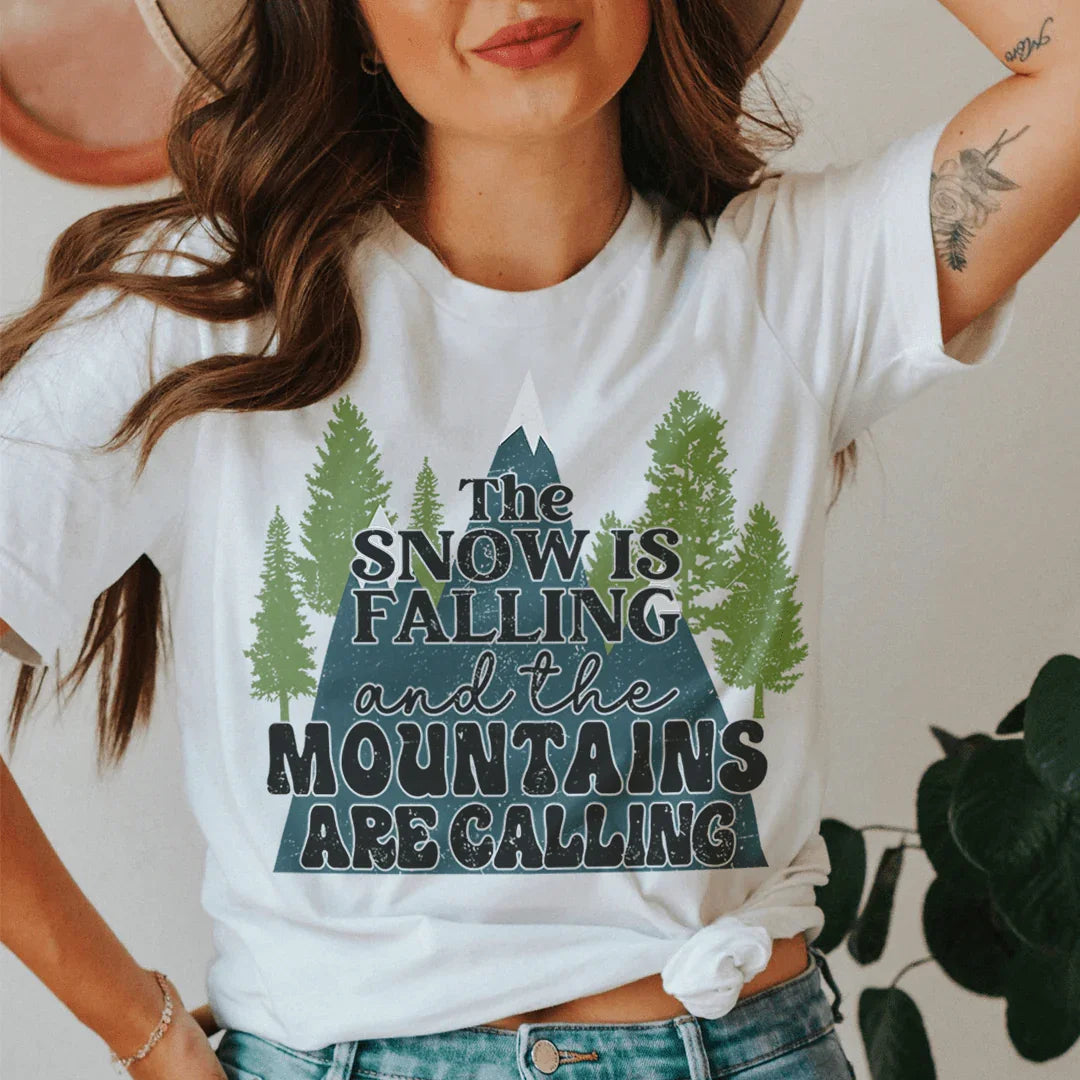 The Snow Is Falling And The Mountains Are Calling Tee Peachy Sunday