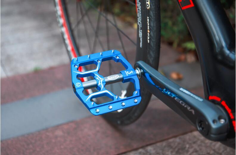 Wide Flat Mountain Road Cycling Bicycle Bike Pedal 3 Sealed Bearings 9/16 in Aluminum With Removable Antiskid Cleats Mountain Bike Pedal Platform Flat Bicycle Pedals Aluminum Alloy Non-Slip Metal Bike Pedals With 3 Bearings For Road Stevvex